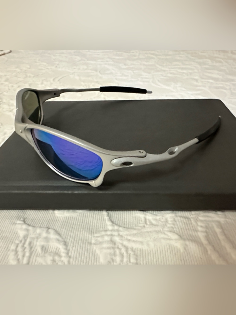 Oakley-maybe Silver Frame Sunglasses with Blue Mirrored Lenses